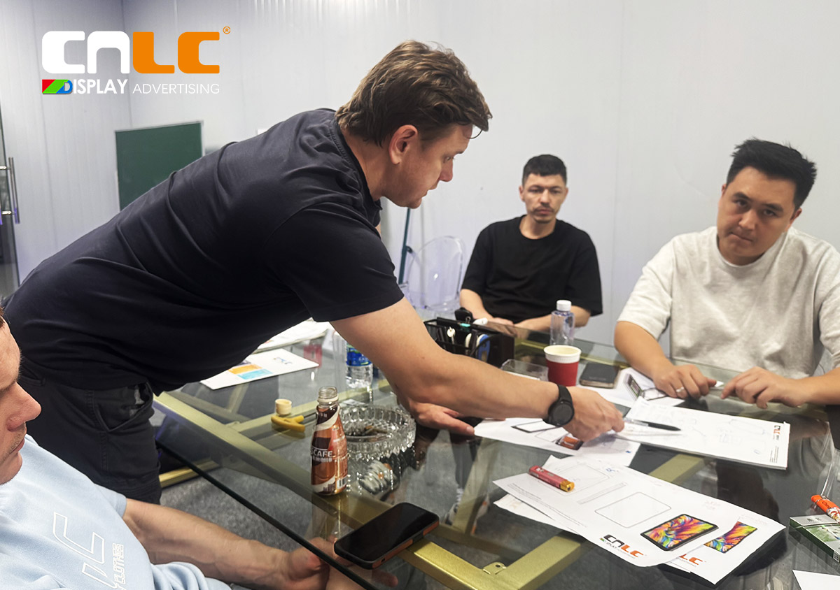 Clients discussing technical solutions with CNLC team in meeting room.