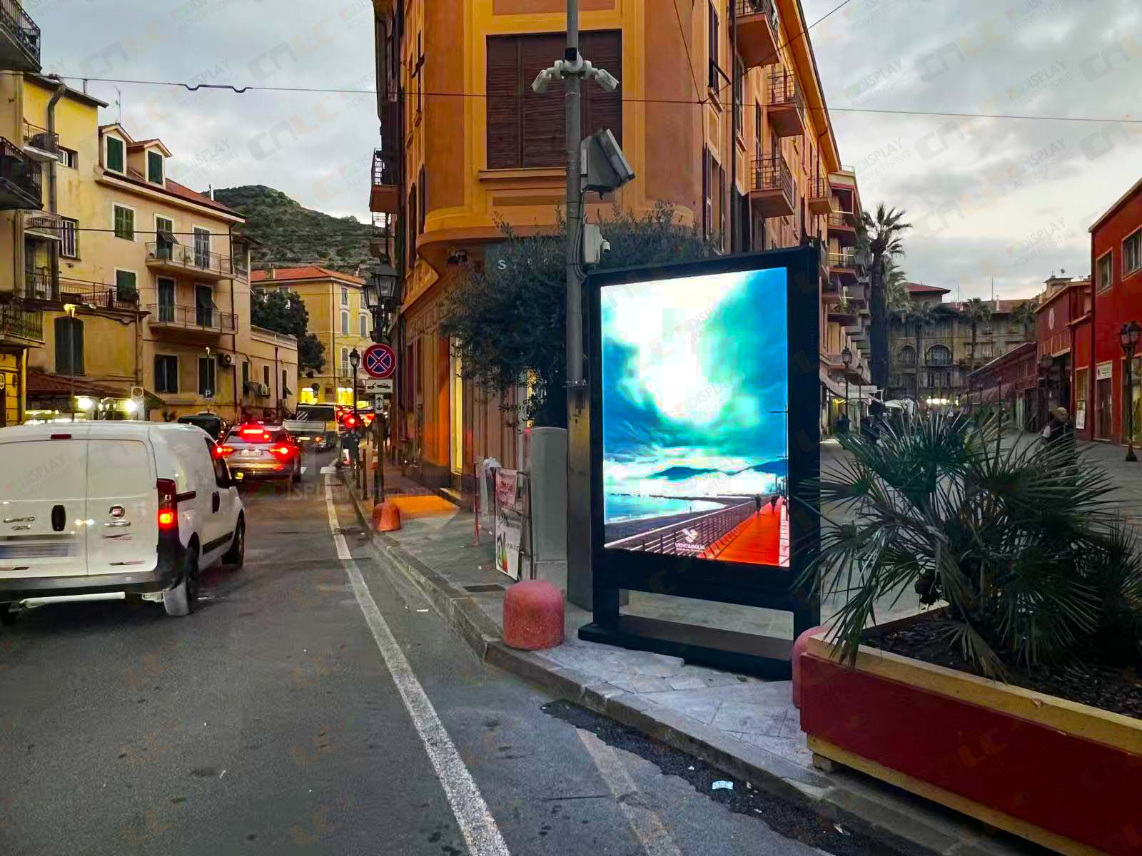 LED Totem side view on urban street, aluminum cabinet with side-opening maintenance design